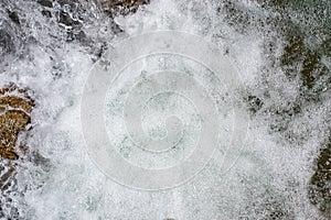 Waterfall from ravine.waterfall from the mountain river. rapid current