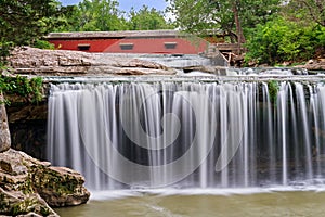 Waterfall and Red Covered Bridge