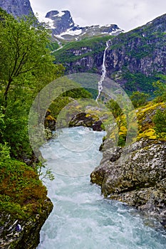 Waterfall and river from Briksdalsbreen Briksdal glacier. Jostedalsbreen National Park. Norway