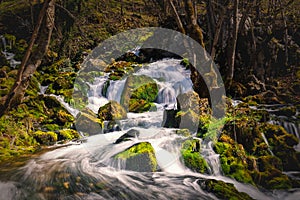 Waterfall on the river in early spring