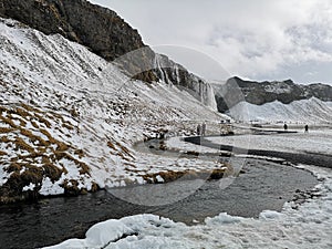 Waterfall and river landscape. Seljalandsfoss waterfall in winter. Iceland