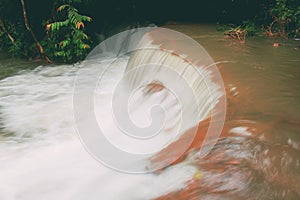 Waterfall and a rock