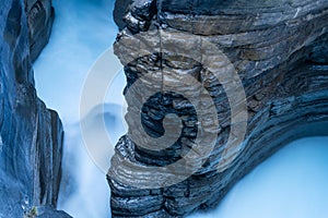 Waterfall and rocks. Long exposure photography. Fast river and waterfall. Natural background and wallpaper.