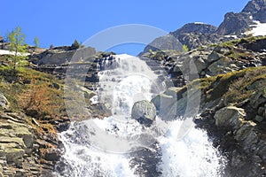 Waterfall and rocks in mountain