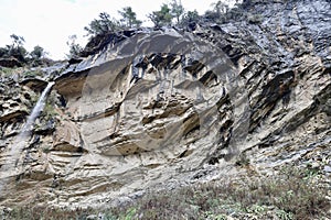 Waterfall rocky cliff