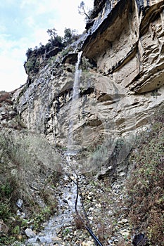 Waterfall rocky cliff