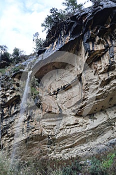 Waterfall rocky cliff