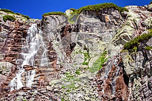 Waterfall and rocky mountains