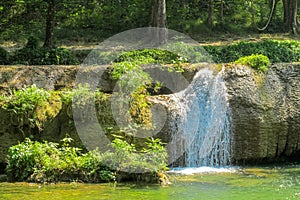 Waterfall run on the rocks in the jungle