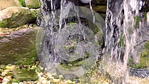 Waterfall running off of rock sculpture piece