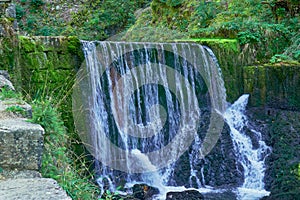 Waterfall at Source du Doubs Mouthe Franche ComtÃ© France with Green Plants