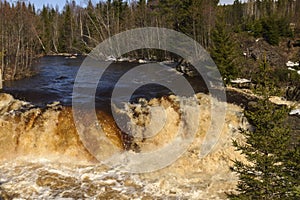 Waterfall with spring water in a little river in vasternorrland sweden photo