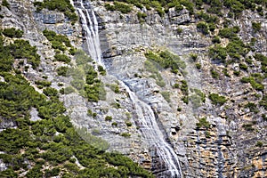 Waterfall stream on stone mountain in Alps view, Stelvio pass