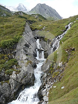 Waterfall at Stubai high-altitude hiking trail in Tyrol, Austria