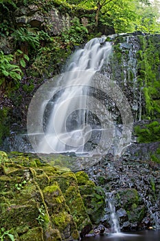 Waterfall on the summer day, shoot with long exposure to give water silky smooth look