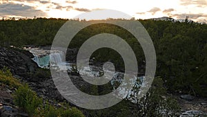 Waterfall on summer evening in Abisko National Park in Sweden