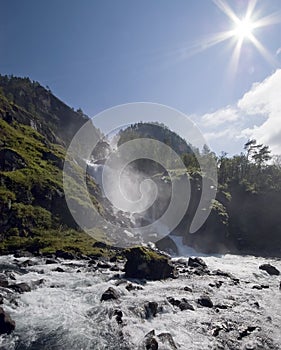 Waterfall and sun