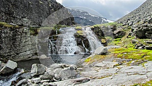 waterfall on top of a mountain