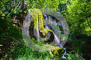 Waterfall in top of mountain photo