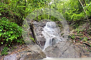 Waterfall in tropical rain forest jungle. Thailand nature