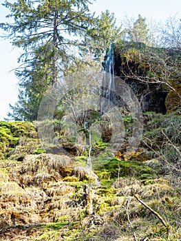 The waterfall of Tuefels Chilen in the hills around Zurich, Switzerland, is famous for its sedimentary tuff structure.