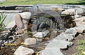 Waterfall tumbling slowly against rocks