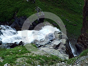 Waterfall Unterer Jetzbachfall in the alpine valley of Im Loch