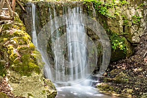 Waterfall in the valley of butterflies Petaloudes on Rhodes island, Greece