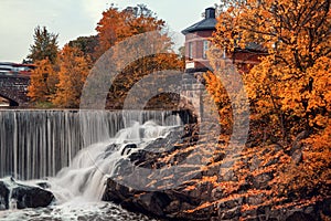 Waterfall in Vanhankaupunginkoski, Helsinki, Finland, autumn.