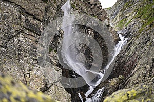 A waterfall in the Velka Zmarzla Valley. Tatra National Park, Slovakia