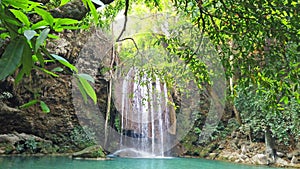 Waterfall water cascade in green forest