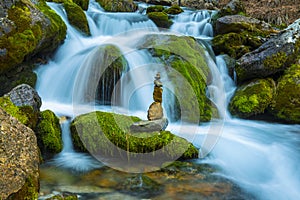 Waterfall waters and zen stones