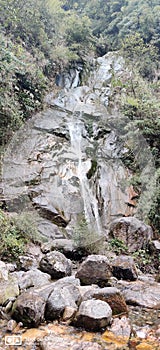 Waterfall wonderfull waterfalls while heading towards silkroute Sikkim between a dence mountain forest