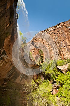 Waterfall in zion national park over the red rocks