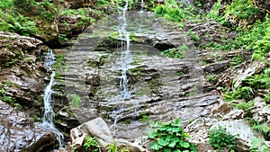 Waterfalls forest virgin nature Vysoky vodopad, aerial drone stream way through stones fairytale summer landscape