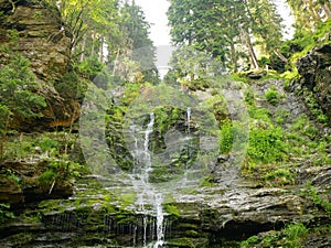 Waterfalls forest virgin nature Vysoky vodopad, aerial drone stream way through stones fairytale summer landscape