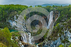 Waterfalls in forested mountains