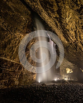Waterfalls in Gaping Gill Cavern in Yorkshire photo