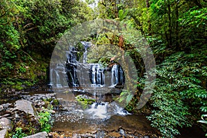 The waterfalls among the green forest