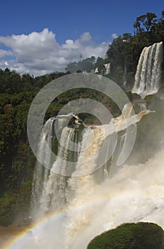 Waterfalls of Iguazu forming a rainbow in the spray, Argentina