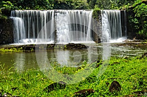 Waterfalls in Kauai Hawaii in green lush jungle photo