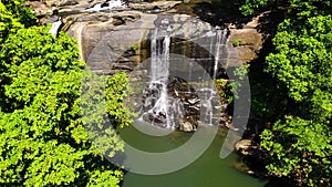 Waterfalls in a mountain gorge in the tropical jungle.