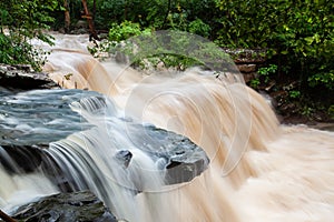 Waterfalls of mountain stream, smooth water over waterfalls