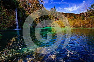 Waterfalls in national park falling into turquoise lake. Plitvice Croatia