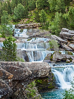 Waterfalls in Ordesa and monte perdido national park in Pyrenees range in Spain, Huesca, gradas Soaso vertical photo