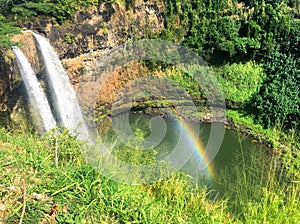Waterfalls with rainbow at Wailua Falls on Kauai Hawaii