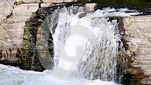 Waterfalls and river with running water in autumn.The Hog's Back Falls in Canada.