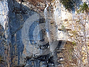 Waterfalls on the seasonal alpine creeks under the Churfirsten mountain range and over Lake Walensee, Walenstadtberg