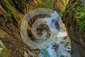 Waterfalls Stanghe Gilfenklamm localed near Racines, Bolzano in South Tyrol, Italy. Wooden bridges and runways lead through the