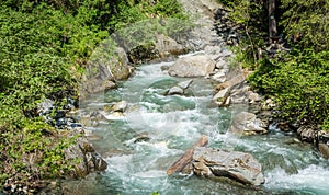 Waterfalls Stanghe Gilfenklamm localed near Racines, Bolzano in South Tyrol, Italy. Wooden bridges and runways lead through the